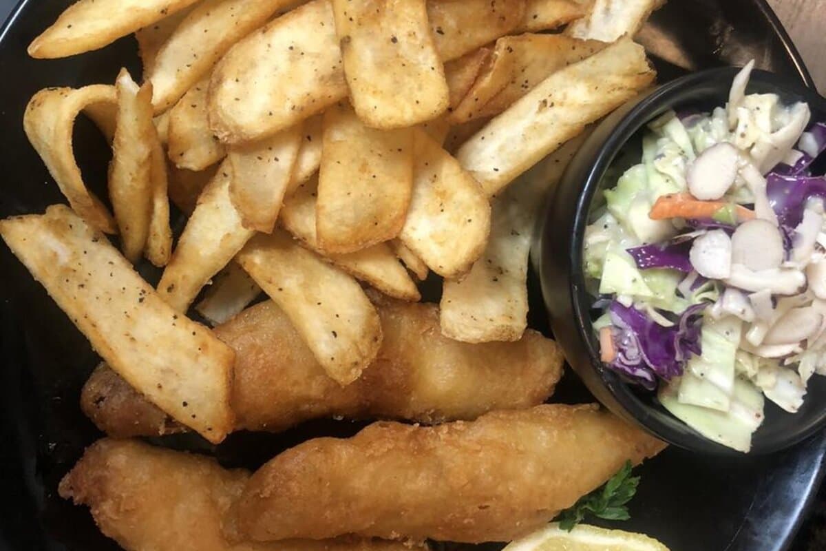 Breaded fish po'boy on a toasted hoagie roll